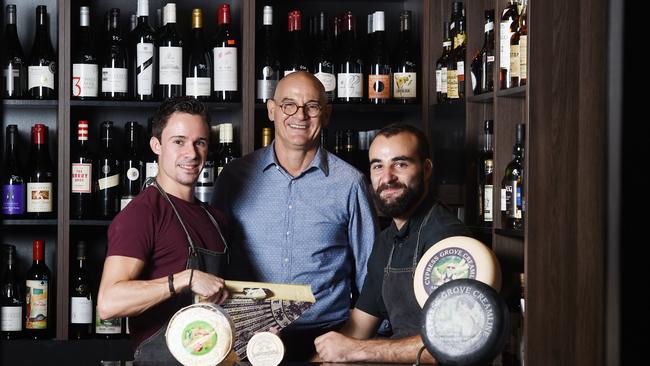 HOME: Parap Fine Foods deli manager Erwan Desvalois, owner Neville Pantazis and wholesale manager Sebastien Kornprobst in the cellar with some of the shops cheeses in 2016