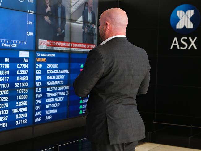 SYDNEY, AUSTRALIA - NewsWire Photos FEBRUARY 16, 2021, A businessman is seen reviewing the Stock prices at the  the ASX today in the CBD, Sydney, Australia. Picture: NCA NewsWire / Gaye Gerard