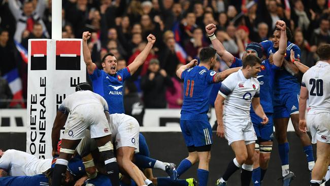 The French team celebrate victory after the Six Nations match at Stade de France.