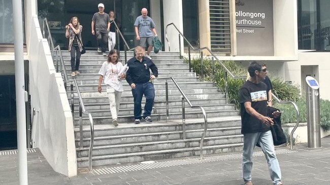 Graham leaves Wollongong Court in February with a group of supporters.