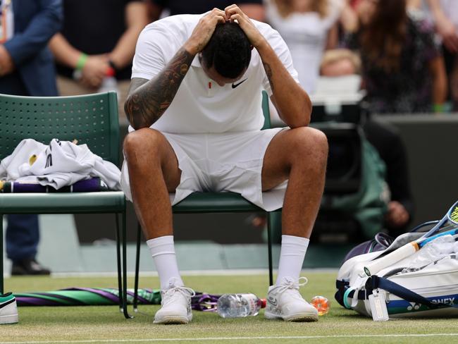 Nick Kyrgios reacts after his injury-forced retirement from Wimbledon. Picture: Getty Images