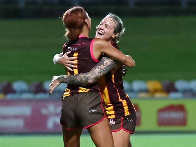 Hawk's Jennifer Wren hugs team mate Tiarne Sparks after she kicks a goal in the AFL Cairns Women's preliminary final match between the Manunda Hawks and the South Cairns Cutters, held at Cazalys Stadium, Westcourt. Picture: Brendan Radke