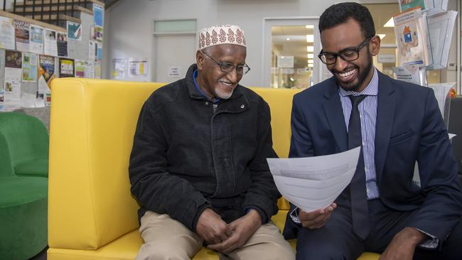 Lawyer Yusuf Mohamud (right) with client Abdullahi Hussin. Picture: Andy Brownbill