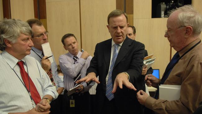 Then treasurer Peter Costello, surrounded by journalists Dennis Shanahan, left, Steve Lewis, Mark Kenny and Paul Kelly, selling his 2007 Budget during the lock-up in Canberra.