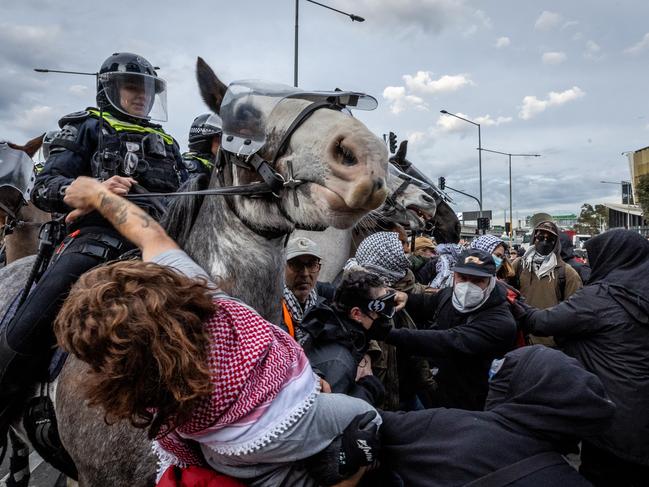 Protesters clash with police at the Disrupt Land Forces rally on Wednesday. Picture: Jake Nowakowski