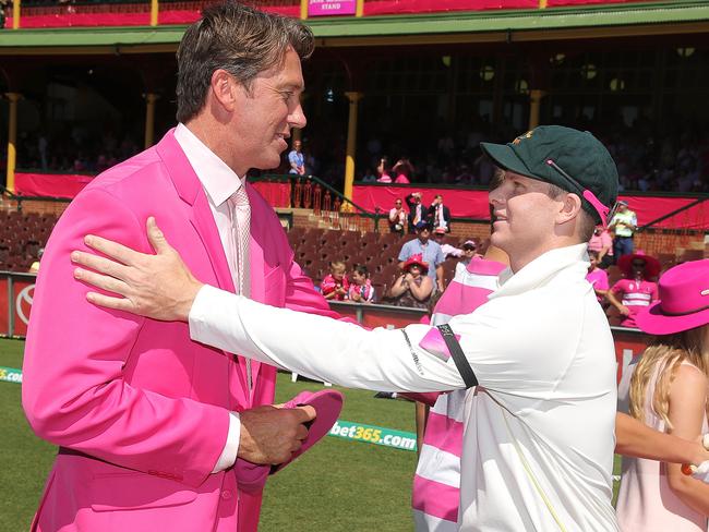 Steven Smith of Australia hands over his pink cap to Glenn McGrath on Jane McGrath day during day three of the Fourth Test match between Australia and India at Sydney Cricket Ground.