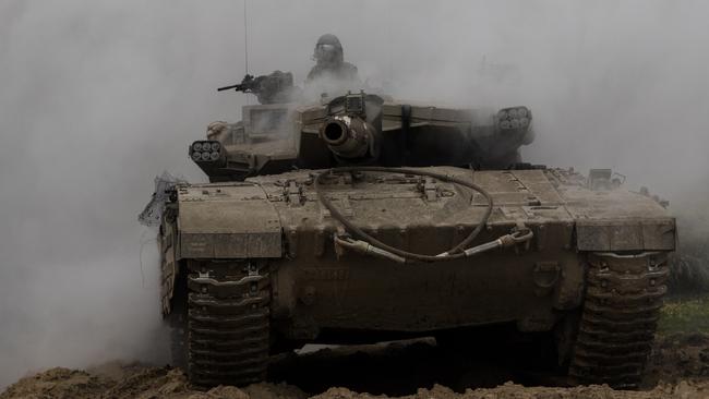 An Israeli tank moves near the border with the Gaza Strip. Picture: Getty Images