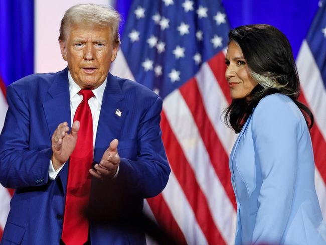 Former US President and Republican presidential candidate Donald Trump (L) claps as he leaves the stage after speaking alongside former US Representative Tulsi Gabbardd during a town hall meeting in La Crosse, Wisconsin, on August 29, 2024. Picture: KAMIL KRZACZYNSKI / AFP