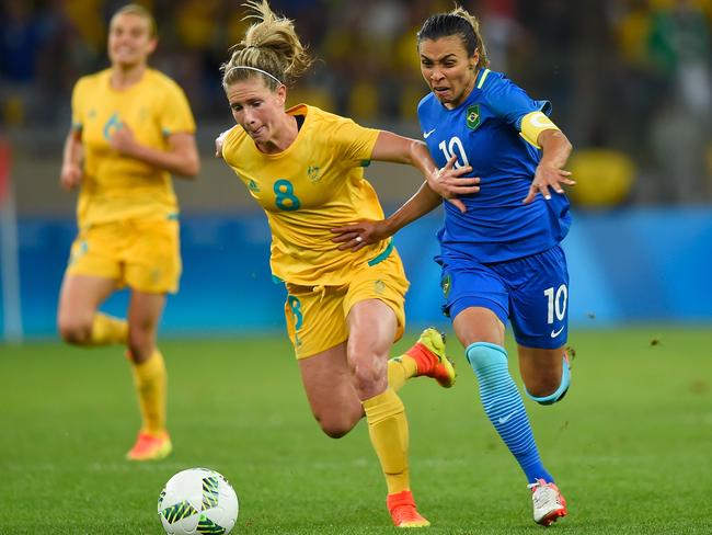 Elise Kellond-Knight and Marta in a race for the ball at the Olympics.