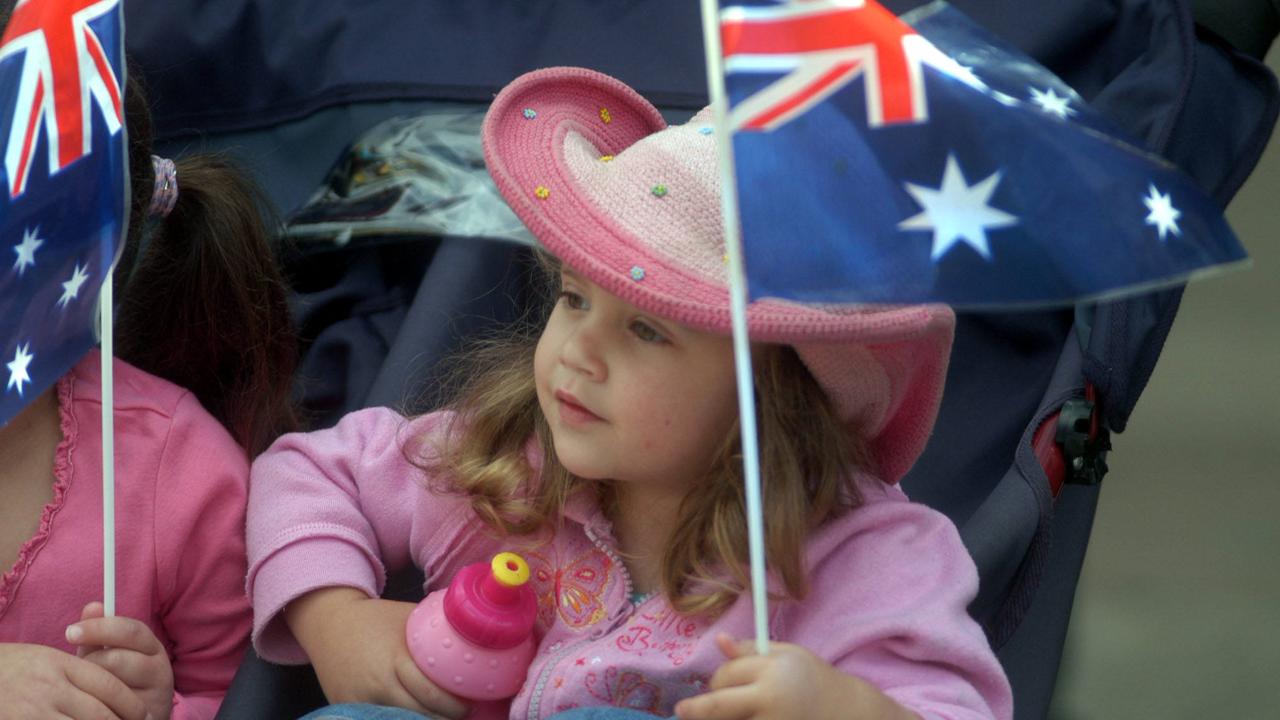 Young spectator enjoying the vantage point of her pram during Toowoomba Carnival of Flowers – Street Parade that took place through the city. Strong winds forced the cancellation last year. The first time in its 50 (plus) year history. Picture: David Martinelli.