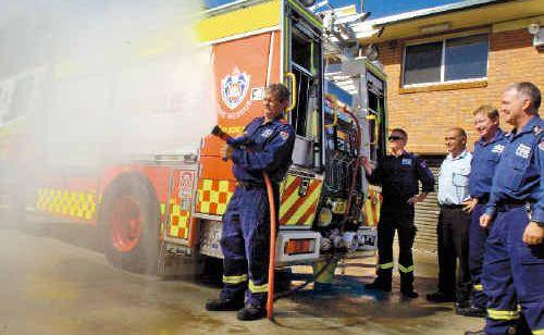 Testing the hoses on their new fire truck are Lismore fire station crew (from left), Captain Brett Lowden, senior firefighter James Connors, Superintendent Chris Fabri, senior firefighter Greg Marker and station officer Ian Grimwood. Picture: CATHY ADAMS