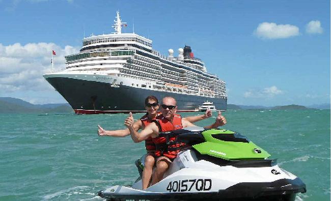 ROYAL VISIT: Townsville newlyweds Kris and Vicky Brennan enjoyed a close shave with visiting cruise ship the Queen Elizabeth on their Whitsunday Jetski Tours ’Daydream extreme’ tour. Picture: Contributed