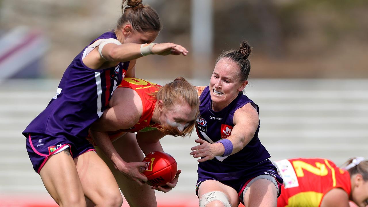 Best afield Kiara Bowers and Kara Antonio put the clamps on Sun Tiarna Ernst. Picture: AAP