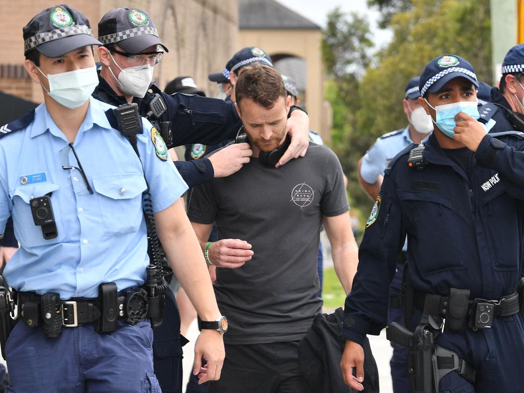 Police detain a man in Sydney. Picture: Saeed KHAN/AFP