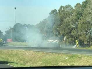 Fire Fighters had to put out a blaze which destroyed two cars following a police chase through Tweed. PHOTO: Justin Davis