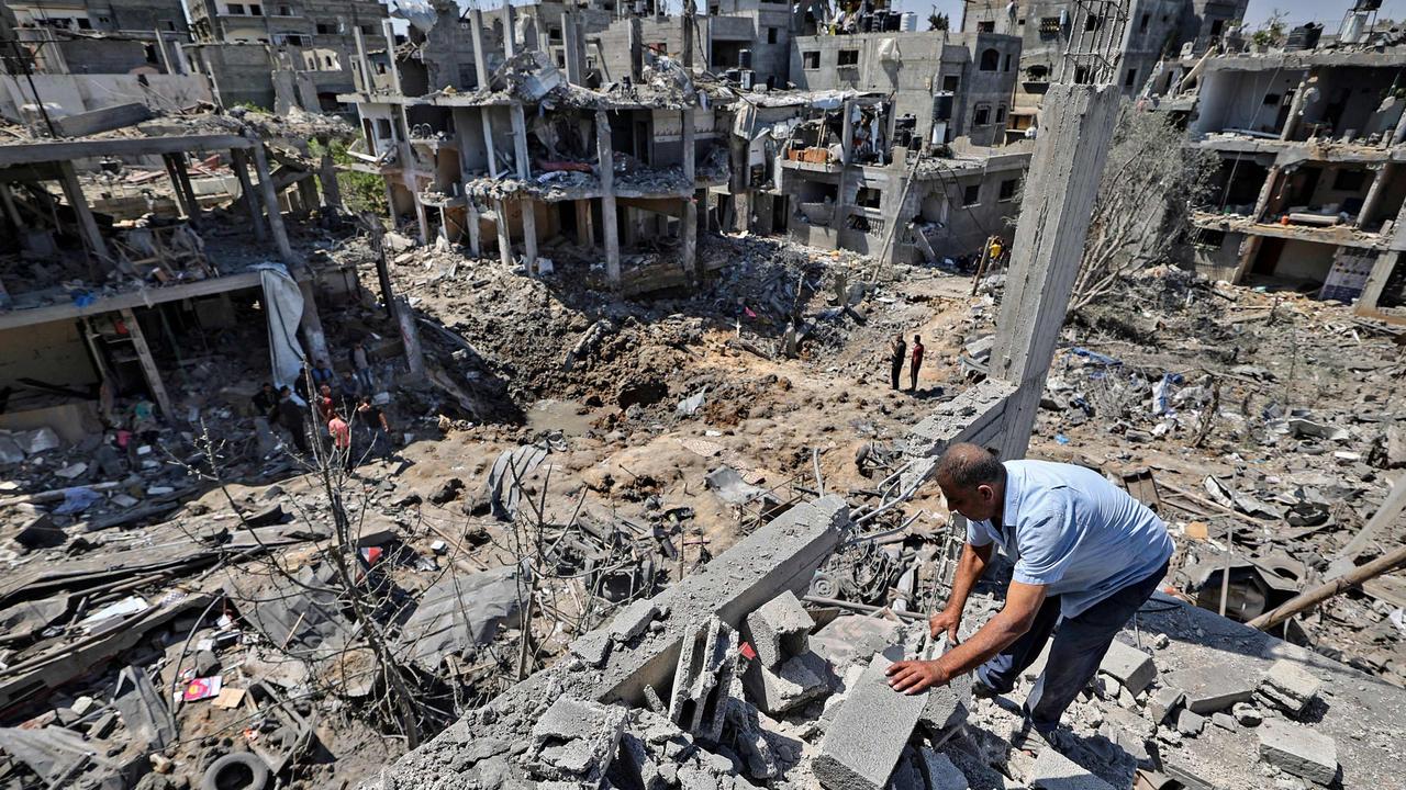 Palestinians assess the damage caused by Israeli air strikes, in Beit Hanun in the northern Gaza Strip. Picture: MAHMUD HAMS / AFP
