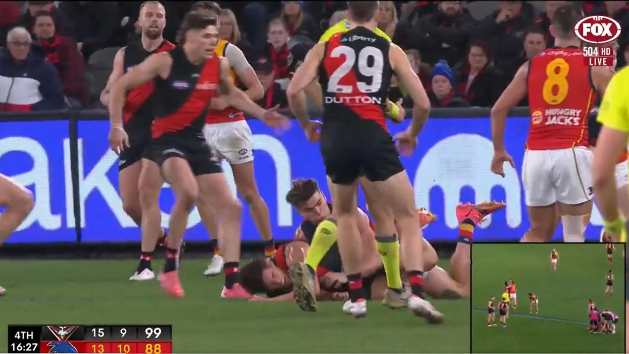 Ben Keays of the Crows lays a tackle.