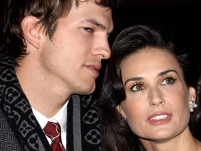 US actress Demi Moore (R) and her husband Ashton Kutcher arrive at the British Premiere of her latest film 'Flawless' in London's Covent Garden on November 26, 2008. AFP PHOTO/Max Nash