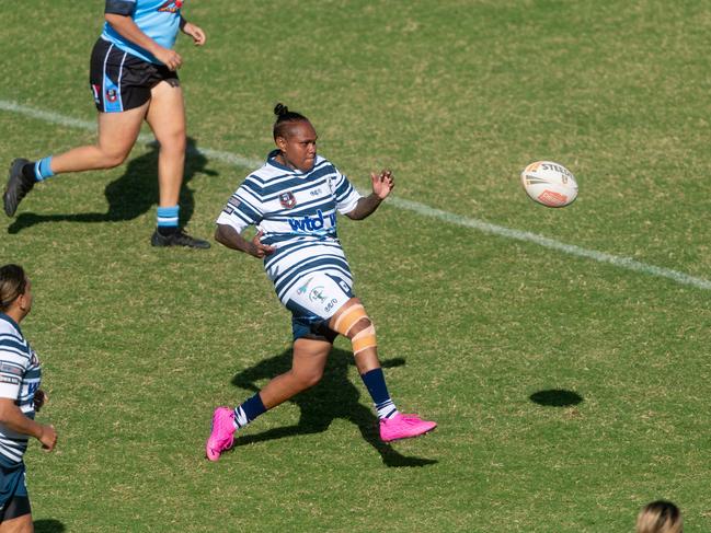 Sistaz’ Leeanne Allia kicks the footy against Northern Sharks. Picture: Che Chorley