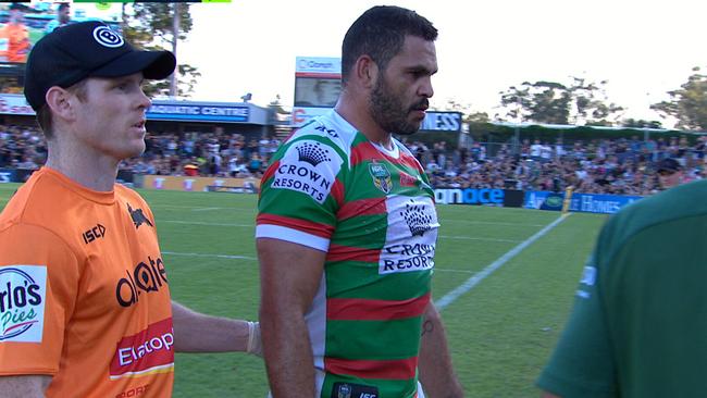 Greg Inglis is helped from the field by a trainer.