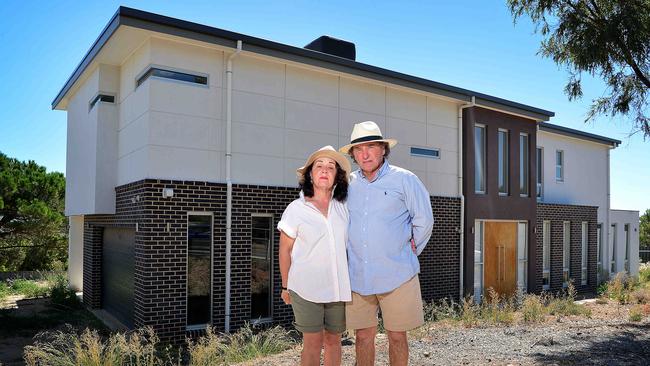 Chris and Deborah Fleetwood outside their house on The Cove Rd. Picture: Bianca De Marchi