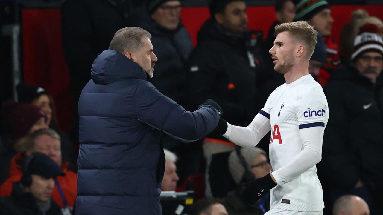 Tottenham Hotspur's German striker Timo Werner is congratulated by Ange Postecoglou. (Photo by Darren Staples / AFP)