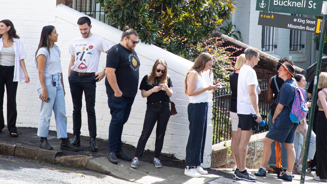 A long line of people wait to inspect rental accommodation in Newtown earlier this year. Picture: Chris Pavlich