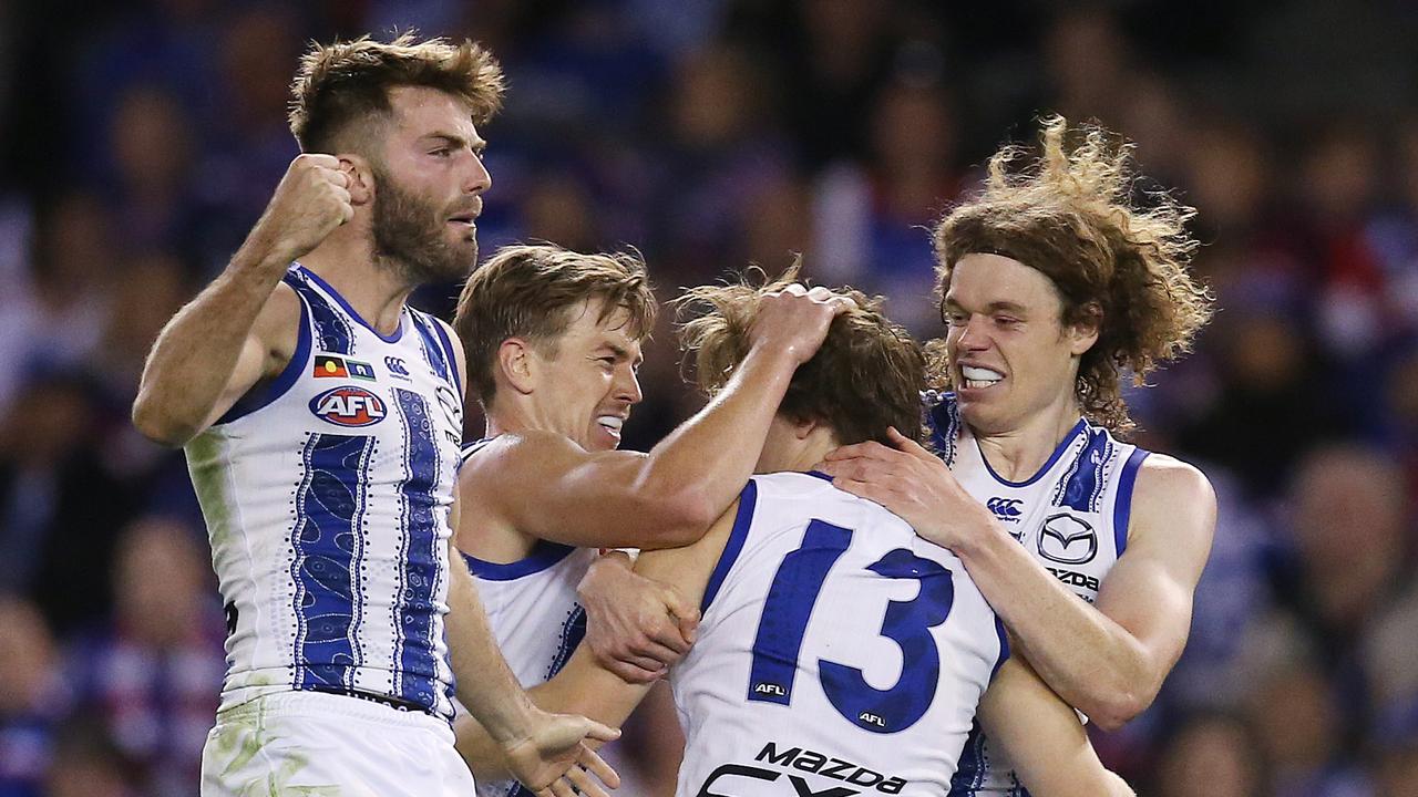 Jared Polec is mobbed by teammates after nailing a last-term goal. Picture: Michael Klein.