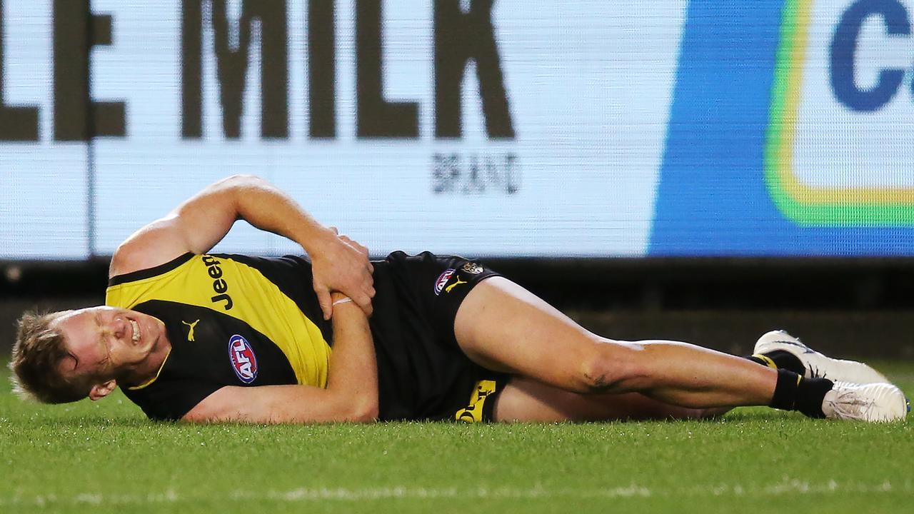 Jack Riewoldt lays on the MCG after hurting his wrist last Thursday night.