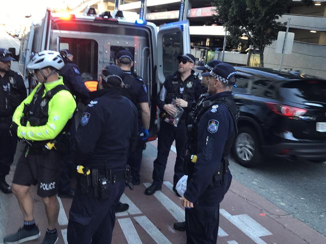 Two climate change protesters are arrested by police in the Brisbane CBD. Picture: Andrea Macleod