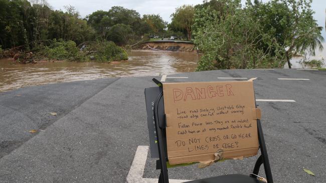 The IGEM meeting at Holloways Beach heard locals relied on unconventional communication methods during the December 2023 floods. A sign placed on Casuarina St at Holloways Beach at the time. Picture: Peter Carruthers