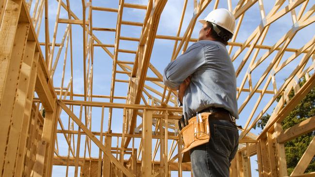 generic pic of builder inside new house under construction