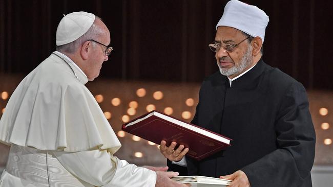 Pope Francis and Egypt's Azhar Grand Imam Sheikh Ahmed al-Tayeb greet each other after signing documents during the Human Fraternity Meeting at the Founders Memorial in Abu Dhabi on February 4. Picture: Vincenzo Pinto/AFP