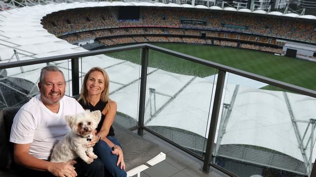 Anna Perfetto and Robert Felesian on their apartment balcony overlooking the Gabba. They bought the adjacent unit as well because of an expected Olympics uplift. Picture: Liam Kidston