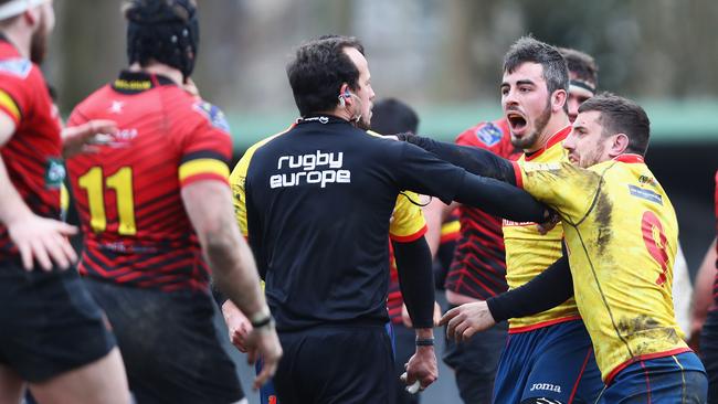 Spanish players confront the referee after defeat in the Rugby World Cup 2019 Europe Qualifier match against Belgium.
