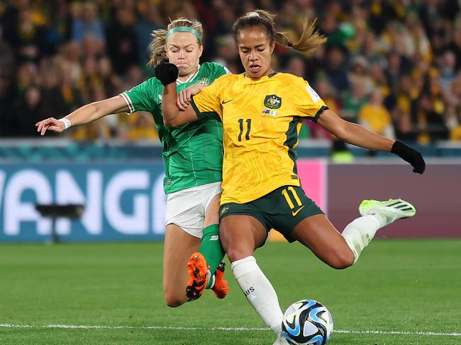 SYDNEY, AUSTRALIA - JULY 20: Mary Fowler of Australia shoots at goal while Ruesha Littlejohn of Republic of Ireland attempts to block during the FIFA Women's World Cup Australia & New Zealand 2023 Group B match between Australia and Ireland at Stadium Australia on July 20, 2023 in Sydney, Australia. (Photo by Cameron Spencer/Getty Images)