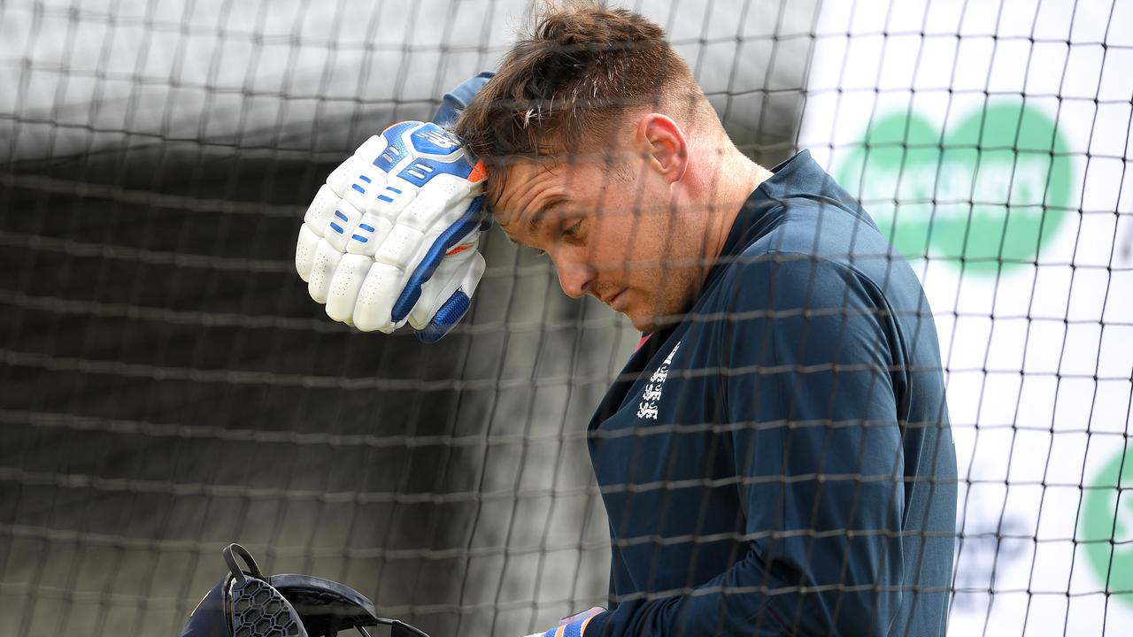 Jason Roy receives treatment after being hit by a ball during a nets session.