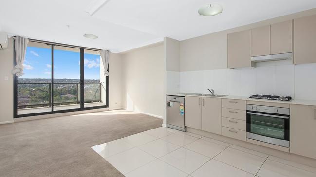 The kitchen and living area of the unit. Picture: Laing + Simmons