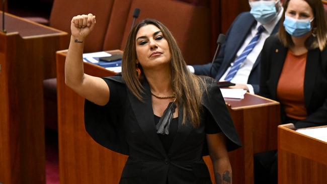 Australia Greens Senator for Victoria Lidia Thorpe raises her arm during her swearing-in ceremony in the Senate chamber at Parliament House. Picture: AAP