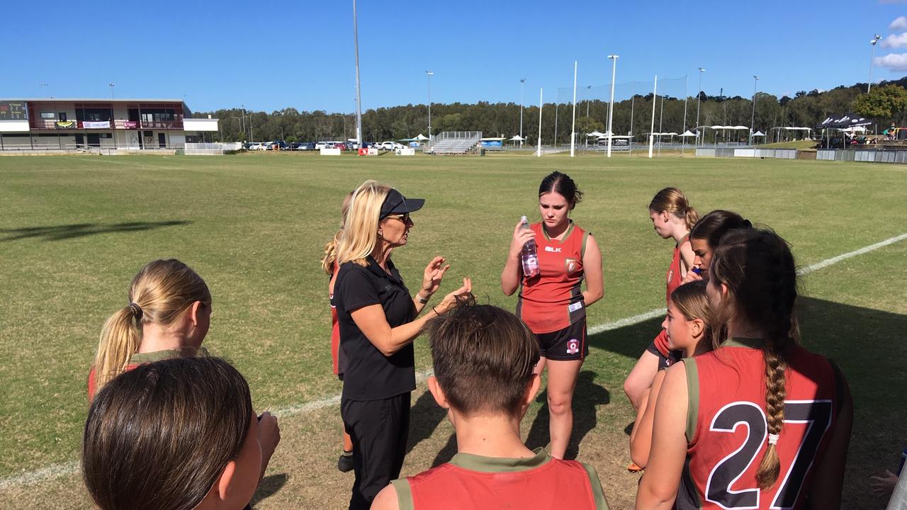 St Teresa’s Catholic College coach addresses her team in the quarterfinal