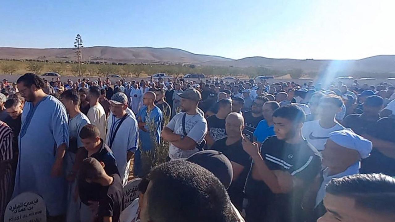 Mourners attend the funeral of Bilal Kissi, shot dead by the Algerian coastguard when he and a fellow jet skier strayed across the maritime border between Algeria and Morocco. (Photo by AFP)