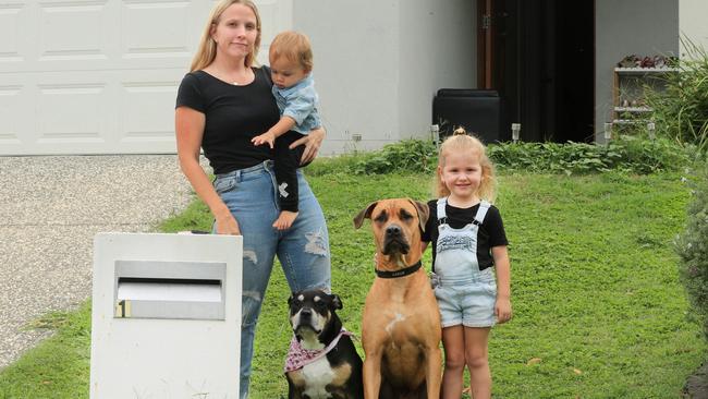 Dyani Pinnell with Aliyah, 4, and Rivah, 1 and her dogs Sarge and Marli. Picture: Scott Powick.