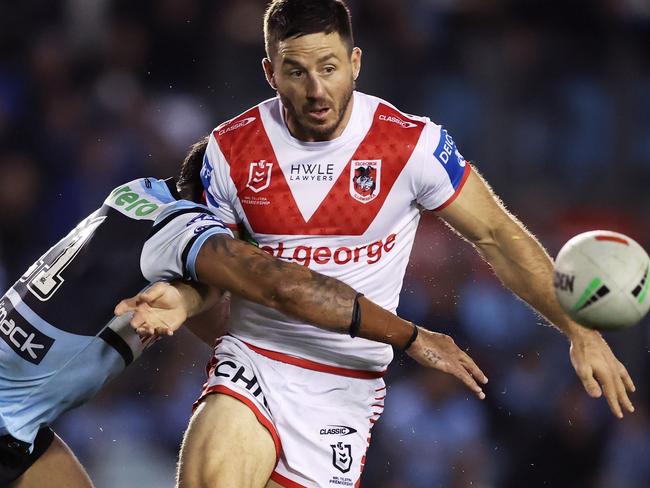 SYDNEY, AUSTRALIA - MAY 05:  Ben Hunt of the Dragons offloads the ball in a tackle during the round nine NRL match between Cronulla Sharks and St George Illawarra Dragons at PointsBet Stadium, on May 05, 2024, in Sydney, Australia. (Photo by Matt King/Getty Images)