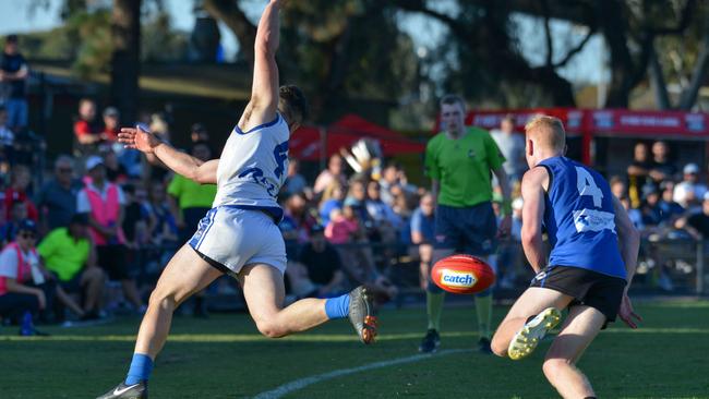 Crowds watch on at Thebarton Oval as Athelstone’s Josh Schinella and Unley Mercedes’ Josh Stevens battle for the ball during last year’s division two grand final. Picture: Brenton Edwards