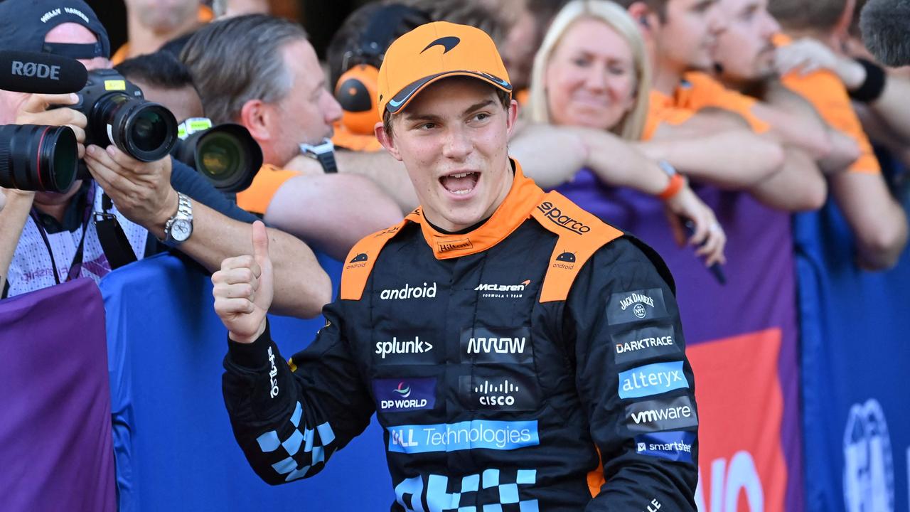 Oscar Piastri celebrates finishing in second in the qualifying session. (Photo by Kazuhiro NOGI / AFP)