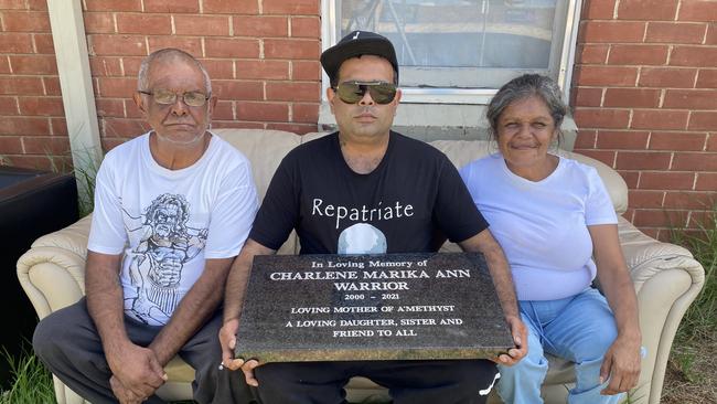 Clifford Warrior (middle) with other family members outside their Seaton home. Picture: Kathryn Bermingham