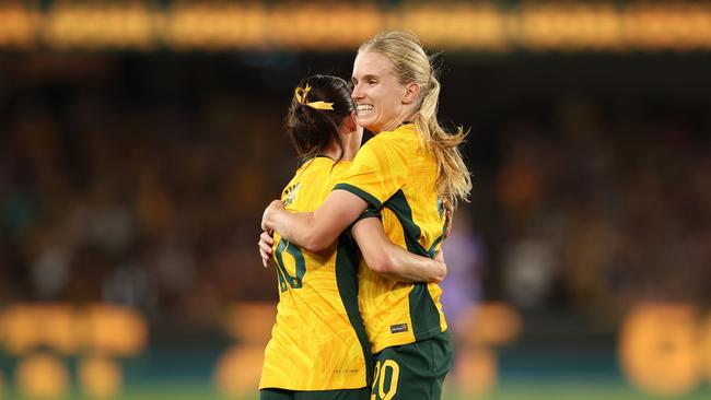 Hayley Raso celebrates scoring a goal with Kaitlyn Torpey after scoring a goal against Uzbekistan at Marvel Stadium. Picture: Kelly Defina/Getty Images.