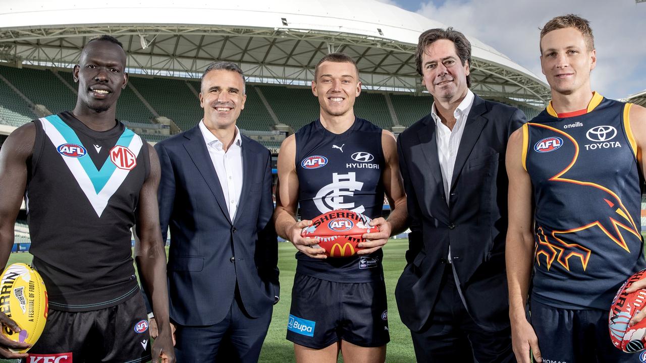 Gillon McLachlan and Peter Malinauskas at Adelaide Oval with Aliir Aliir, Patrick Cripps and Jordan Dawson. Picture: Getty Images