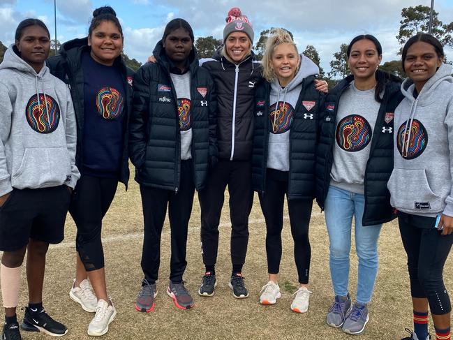 COLES: TOWARDS A BETTER FUTURE/ Essendon First Nations Women's Pathway Program. L-R: Aggie Singh (20), Molly Althouse (19), Freda Puruntatameri (22), Kaitlyn Ashmore (28) from North Melbourne AFLW, Courtney Ugle (25), Iesha Rondberg (18), Alana Combes (22)First Nations girls visit Melbourne for a football clinic in May/June 2021, they were in Melb for 2 weeks before returning home due to the lockdown.