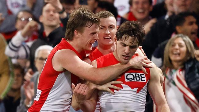 SYDNEY, AUSTRALIA - AUGUST 09: (L-R) James Jordon, Errol Gulden and Chad Warner of the Swans celebrate during the 2024 AFL Round 22 match between the Sydney Swans and the Collingwood Magpies at The Sydney Cricket Ground on August 09, 2024 in Sydney, Australia. (Photo by Michael Willson/AFL Photos via Getty Images)